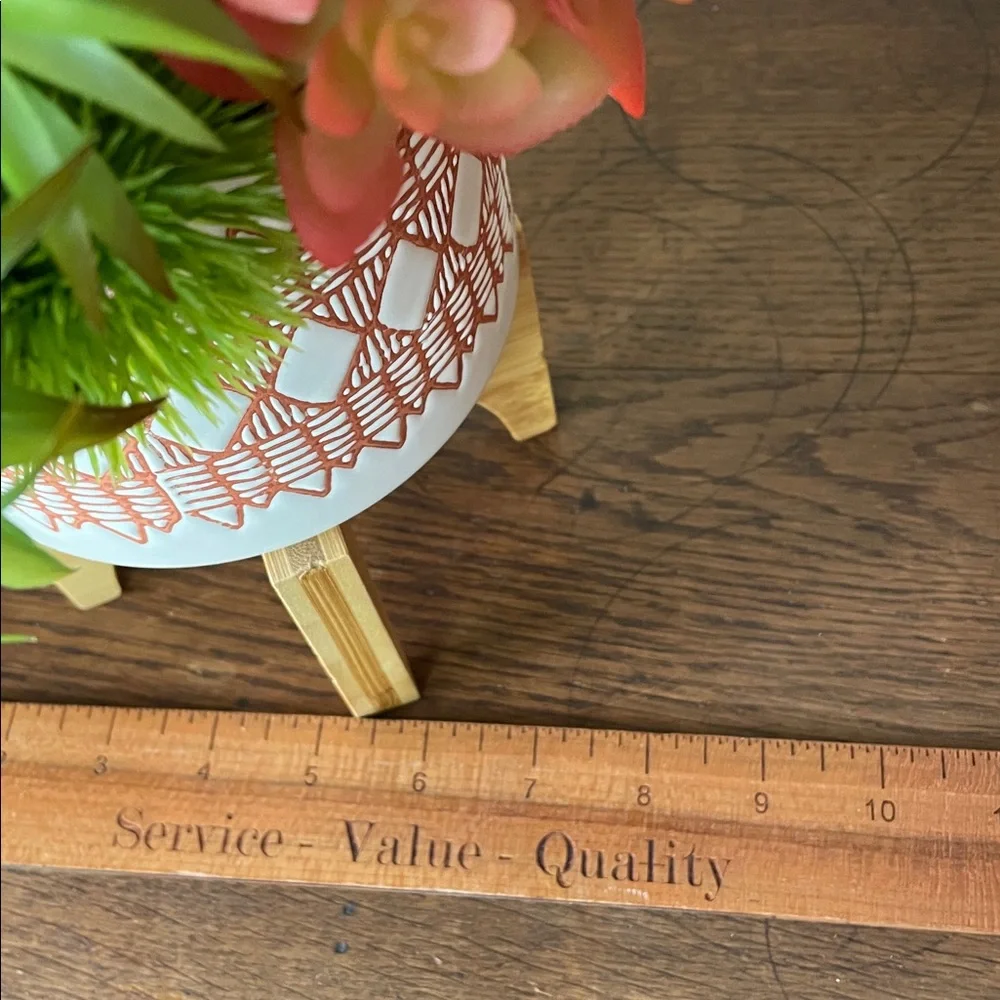 Contemporary Faux Succulent Mix in a Burnt Orange and White Ceramic Footed Vase